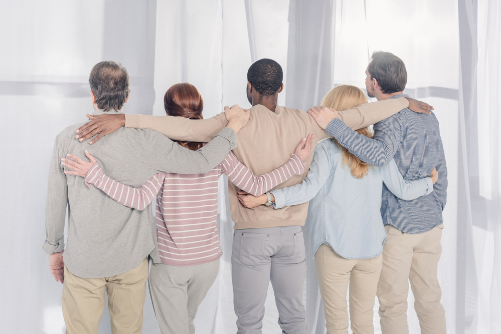 The Five People Hugging Each Other During Rehab Therapy