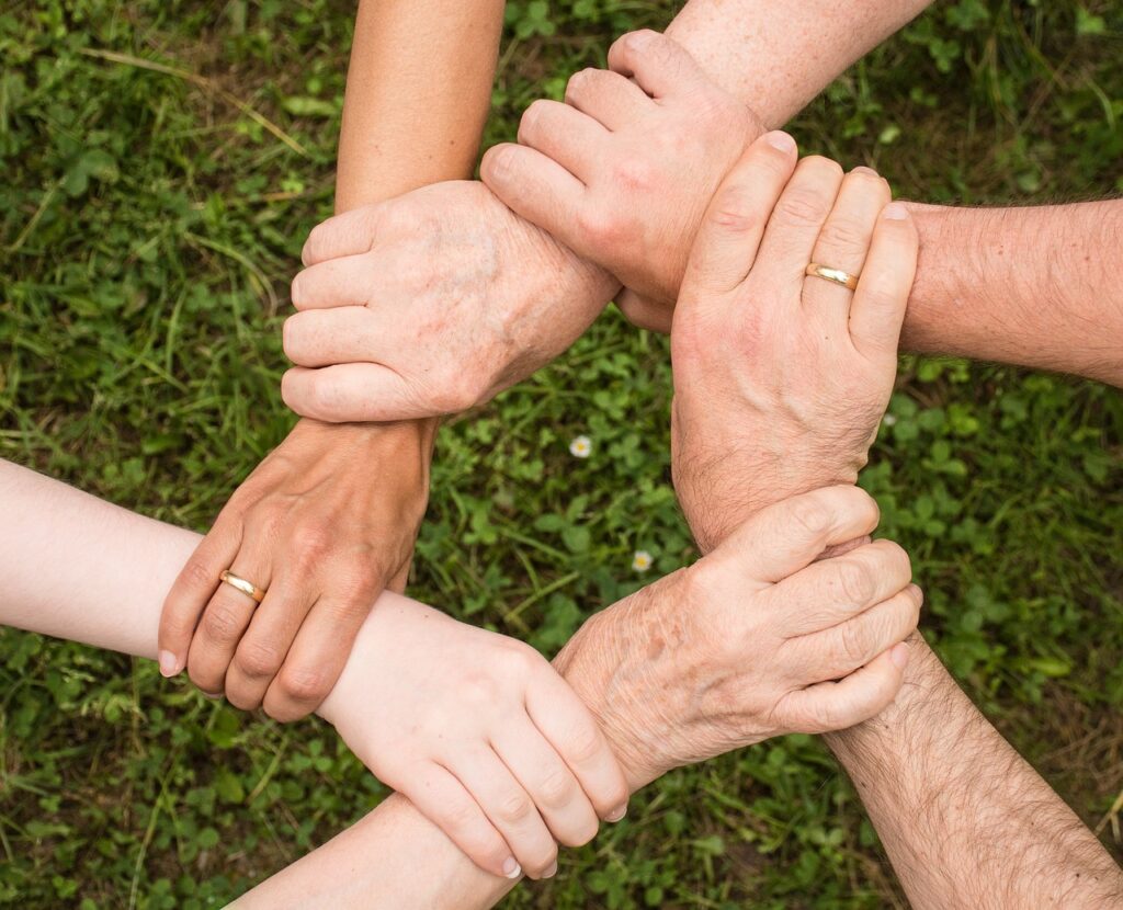 family intervention services for substance abuse, six people holding wrists in a circle