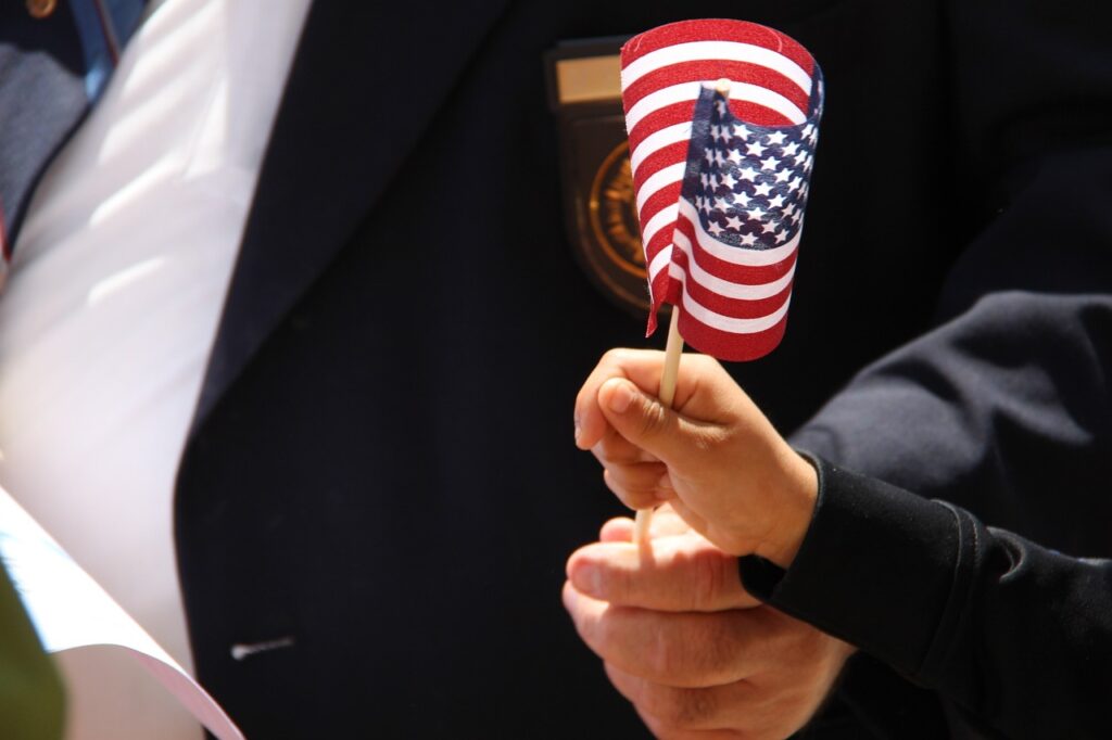 addiction treatment for veterans, hands holding a flag